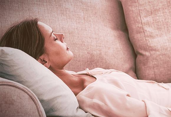 Lady laying on couch in Hypnotherapist session in Brixton
