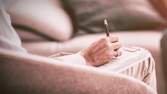 Hypnotherapist taking notes